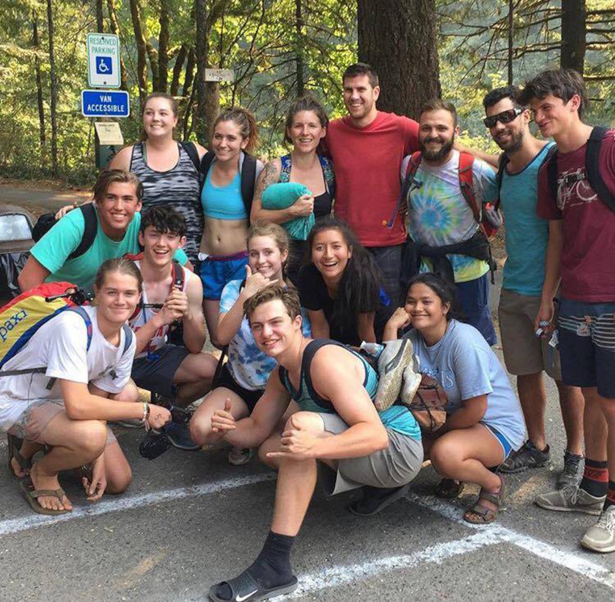 Tech. Sgt. Robert Dones, 349th Medical Squadron surgical technician, (pictured second from top right) poses with a group of hikers after their overnight, 20-plus hour escape from the Eagle Creek Trail fire in the Columbia River Gorge near Portland, Ore, on Sept. 2, 2017. Dones helped guide about 150 hikers from the danger of the fire to safety. (U.S. Air Force courtesy photo provided by Sarah Carlin Ames)