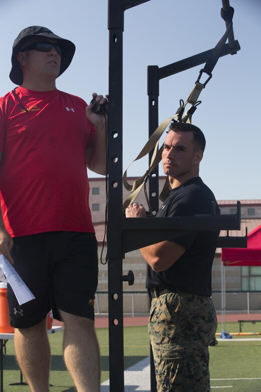 Lance Cpl. Mason McGuff, administrative specialist, air control training squadron, Marine Corps Communication Electronics School, prepares for the first tactical movement of the High Intensity Tactical Training Tactical Athlete Championship at the 11 Area Football Field aboard Marine Corps Base Camp Pendleton, Calif., August 30, 2017. The fast paced competition challenged participants mentally and physically to become fit and adaptable Marines capable of fighting in any clime and place. (U.S. Marine Corps photo by Pfc. Margaret Gale)