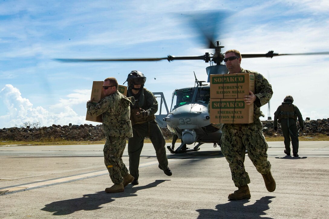 U.S. Marines and Sailors with the 26th Marine Expeditionary Unit (MEU), deliver food and water by way of UH-1Y Venom helicopters to St. Thomas Cyril King E. Airport, U.S. Virgin Islands in effort of aiding victims of Hurricane Irma in the U.S. Virgin Islands, Sept. 10, 2017. The 26th MEU is supporting the lead federal agency in providing humanitarian relief efforts for Hurricane Irma. (U.S. Marine Corps photo by Lance Cpl. Tojyea G. Matally)