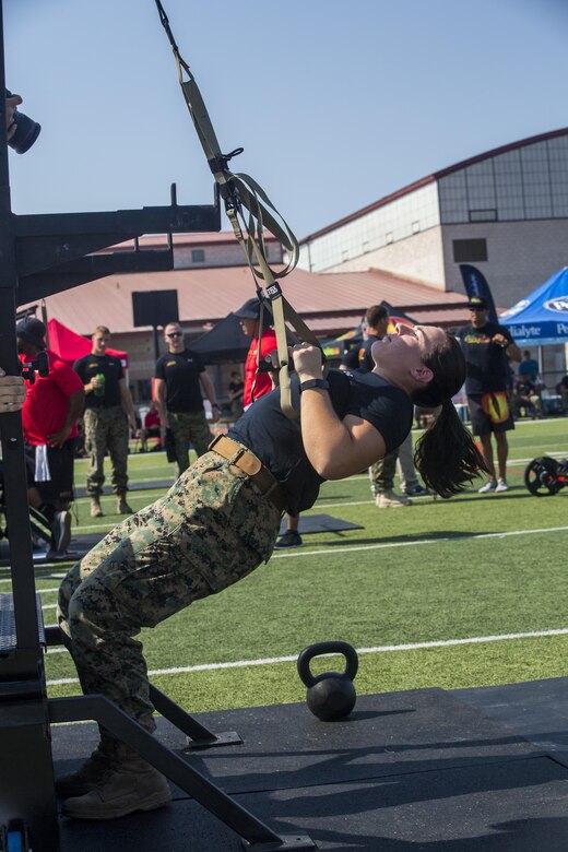 1st Lt. Margo Smutnick, manpower officer, Marine Corps Air Ground Task Force adjutant, performs 10 suspended inverted rows during a High Intensity Tactical Training Tactical Athlete Championship at the 11 Area Football Field aboard Marine Corps Base Camp Pendleton, Calif., August 30, 2017. The fast paced competition challenged participants mentally and physically to become fit and adaptable Marines capable of fighting in any clime and place. (U.S. Marine Corps photo by Pfc. Margaret Gale)