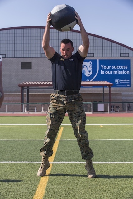 Lance Cpl. Mason McGuff, administrative specialist, air control training squadron, Marine Corps Communication Electronics School, performs 10 medicine ball slams during a High Intensity Tactical Training Tactical Athlete Championship at the 11 Area Football Field aboard Marine Corps Base Camp Pendleton, Calif., August 30, 2017. The fast paced competition challenged participants mentally and physically to become fit and adaptable Marines capable of fighting in any clime and place.