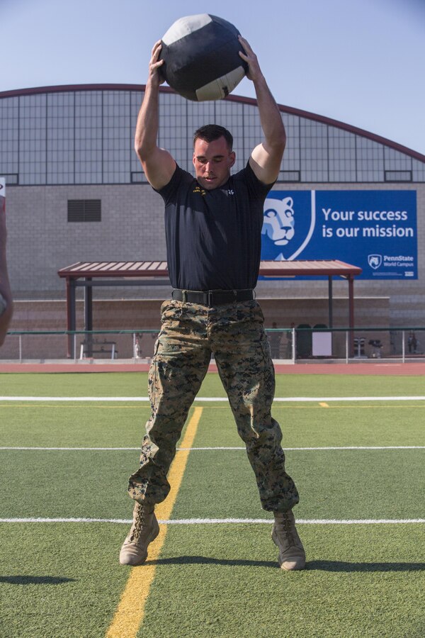Lance Cpl. Mason McGuff, administrative specialist, air control training squadron, Marine Corps Communication Electronics School, performs 10 medicine ball slams during a High Intensity Tactical Training Tactical Athlete Championship at the 11 Area Football Field aboard Marine Corps Base Camp Pendleton, Calif., August 30, 2017. The fast paced competition challenged participants mentally and physically to become fit and adaptable Marines capable of fighting in any clime and place. (U.S. Marine Corps photo by Pfc. Margaret Gale)