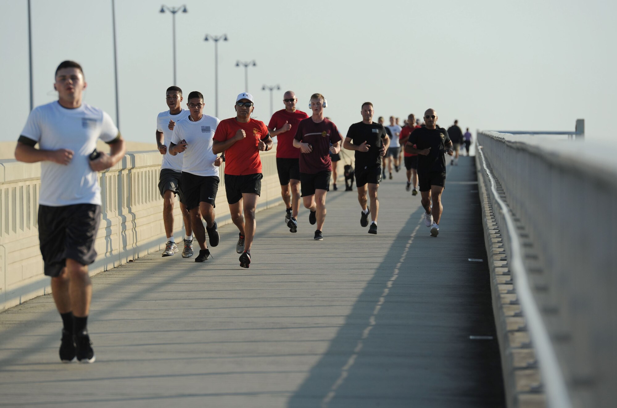 Members of the Keesler Air Force Base Marine Detachment participate in a 3.7 mile remembrance run across the Ocean Springs/Biloxi Bridge Sept. 9, 2017, in Mississippi. The event honored those who lost their lives during the 9/11 attacks. (U.S. Air Force photo by Kemberly Groue)