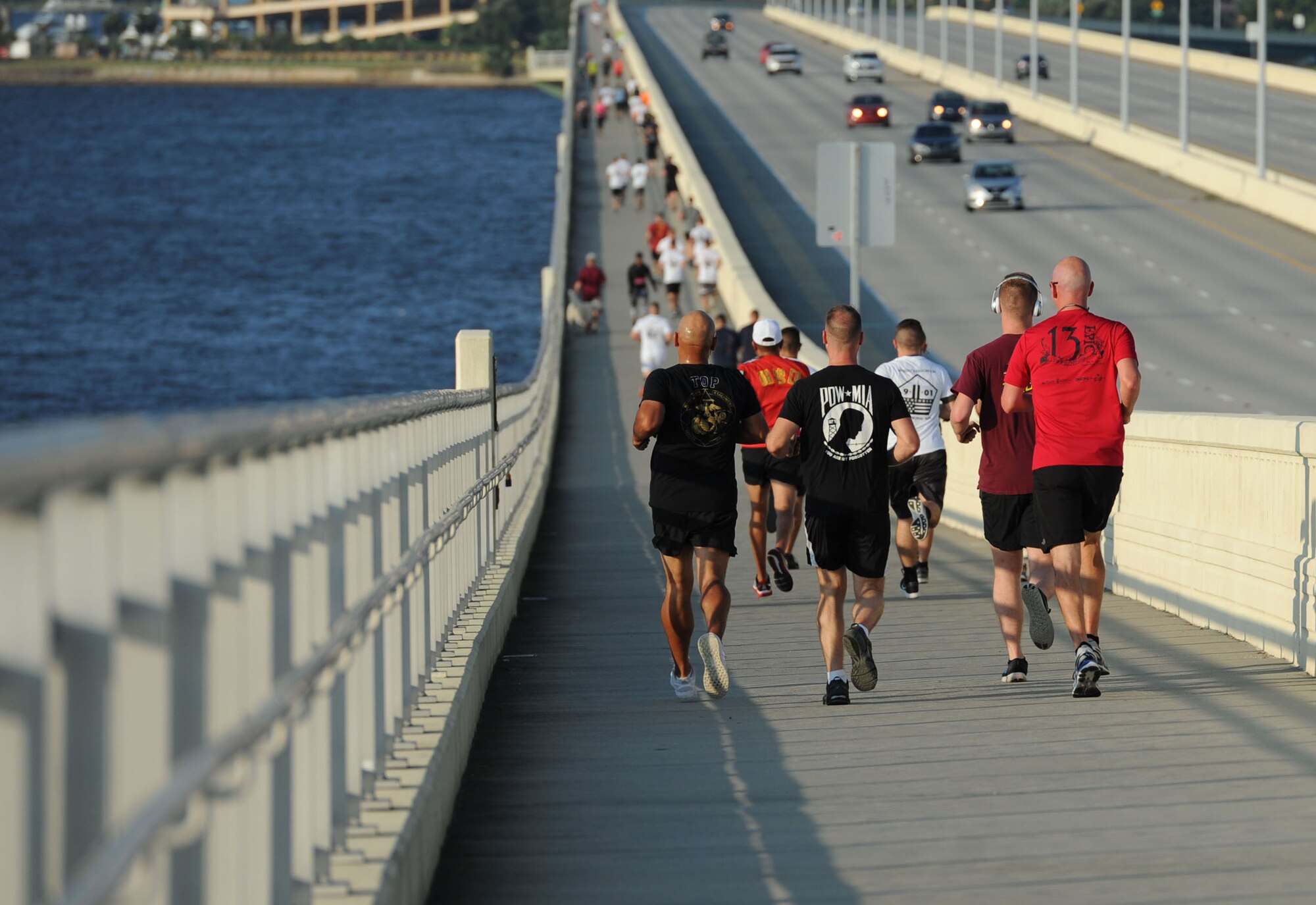 Members of the Keesler Air Force Base Marine Detachment participate in a 3.7 mile remembrance run across the Ocean Springs/Biloxi Bridge Sept. 9, 2017, in Mississippi. The event honored those who lost their lives during the 9/11 attacks. (U.S. Air Force photo by Kemberly Groue)