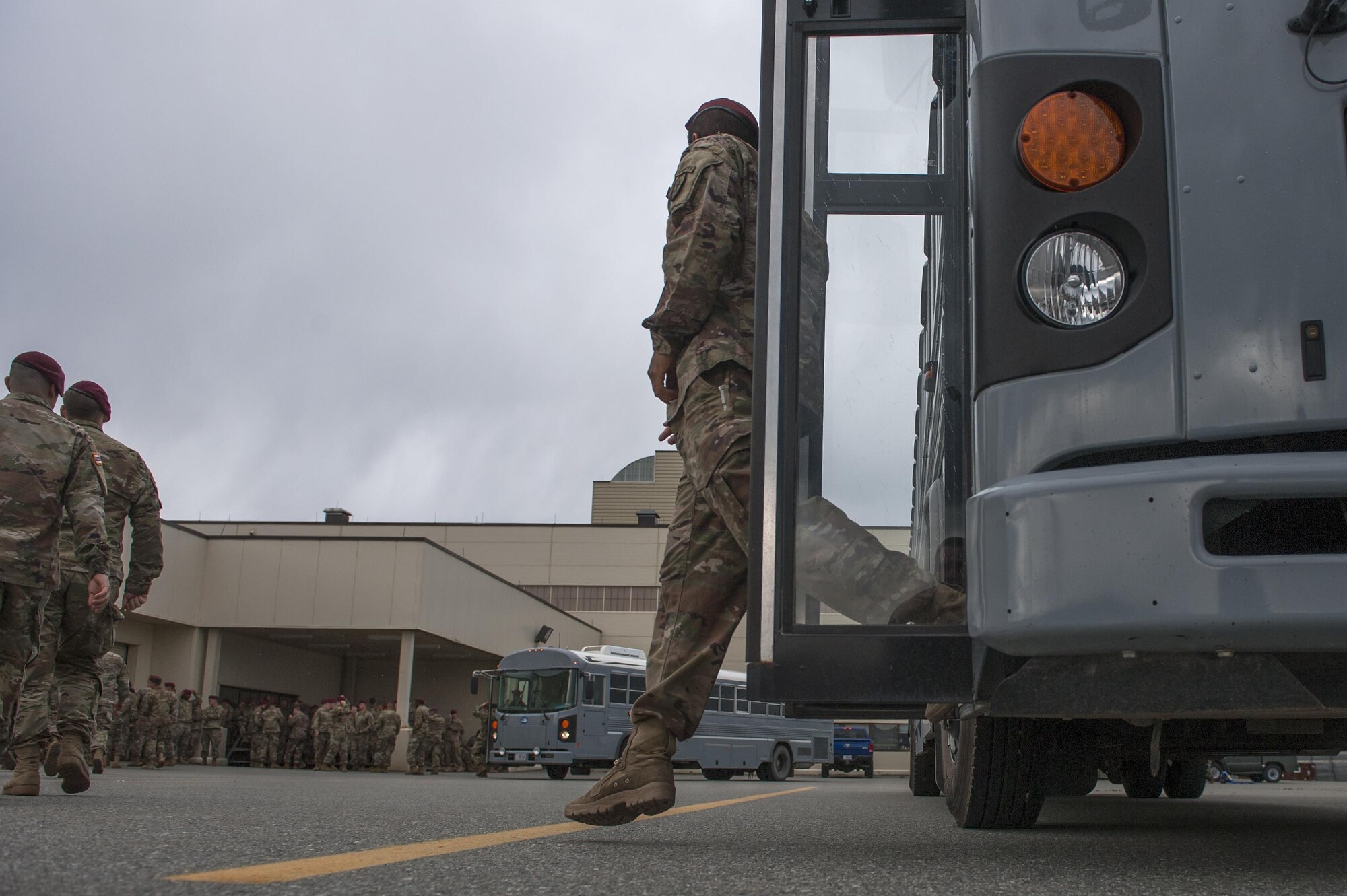 U.S. Army Soldiers with the 4th Brigade Combat Team (Airborne), 25th Infantry Division, leave a bus and walk towards the Joint Mobility Center prior to conducting an airborne jump on Sept. 6, 2017, at Joint Base Elmendorf-RIchardson, Alaska. The Soldiers of 4/25 IBCT (ABN)  recently completed a series of jumps to ensure that they maintain their airborne qualiﬁcation during the brigade’s upcoming deployment to Afghanistan.