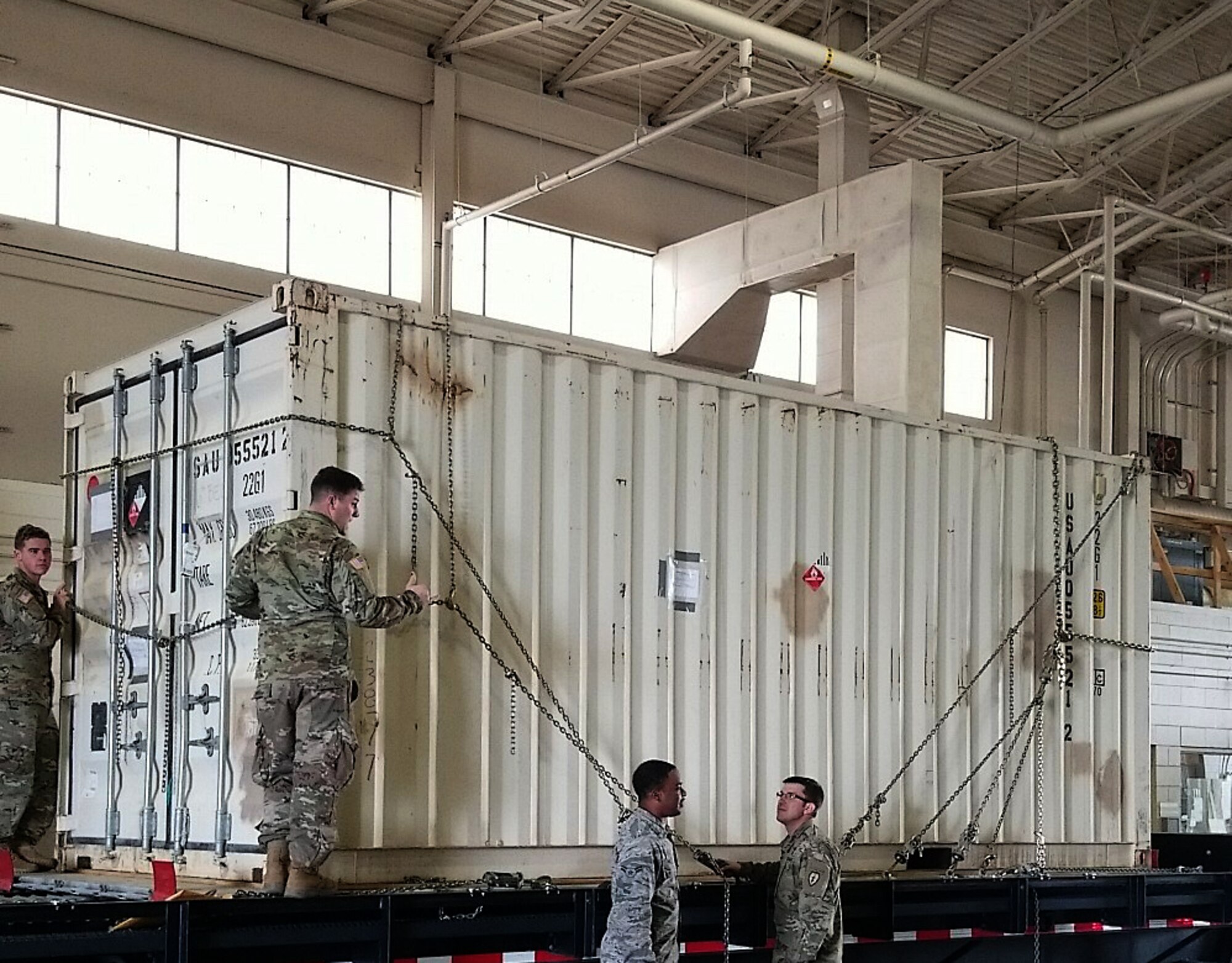 U.S. Army Soldiers and Airmen ready a cargo container for shipment belonging to the 4th Brigade Combat Team (Airborne), 25th Infantry Division, at the Joint Mobility Center that is  Sept. 6, 2017, at Joint Base Elmendorf-RIchardson, Alaska. The Soldiers of 4/25 IBCT (ABN) are in the ﬁnal stages of pre-deployment operations prior to their upcoming deployment to Afghanistan.