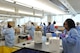 Lab technicians in the Central Operations branch of the 711th Human Performance Wing’s U.S. Air Force School of Aerospace Medicine Public Health and Epidemiology Laboratory unpack boxes of test samples shipped to the lab from around the Air Force Aug. 16, 2017. Between 5,000 – 8,000 specimens are tested six days a week at the lab. (U.S. Air Force photo/Bryan Ripple)