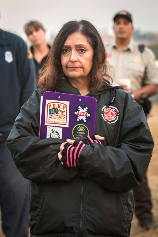 A member of the California Interagency Incident Management Team takes a moment of silence to remember the men and women who lost their lives on 9/11