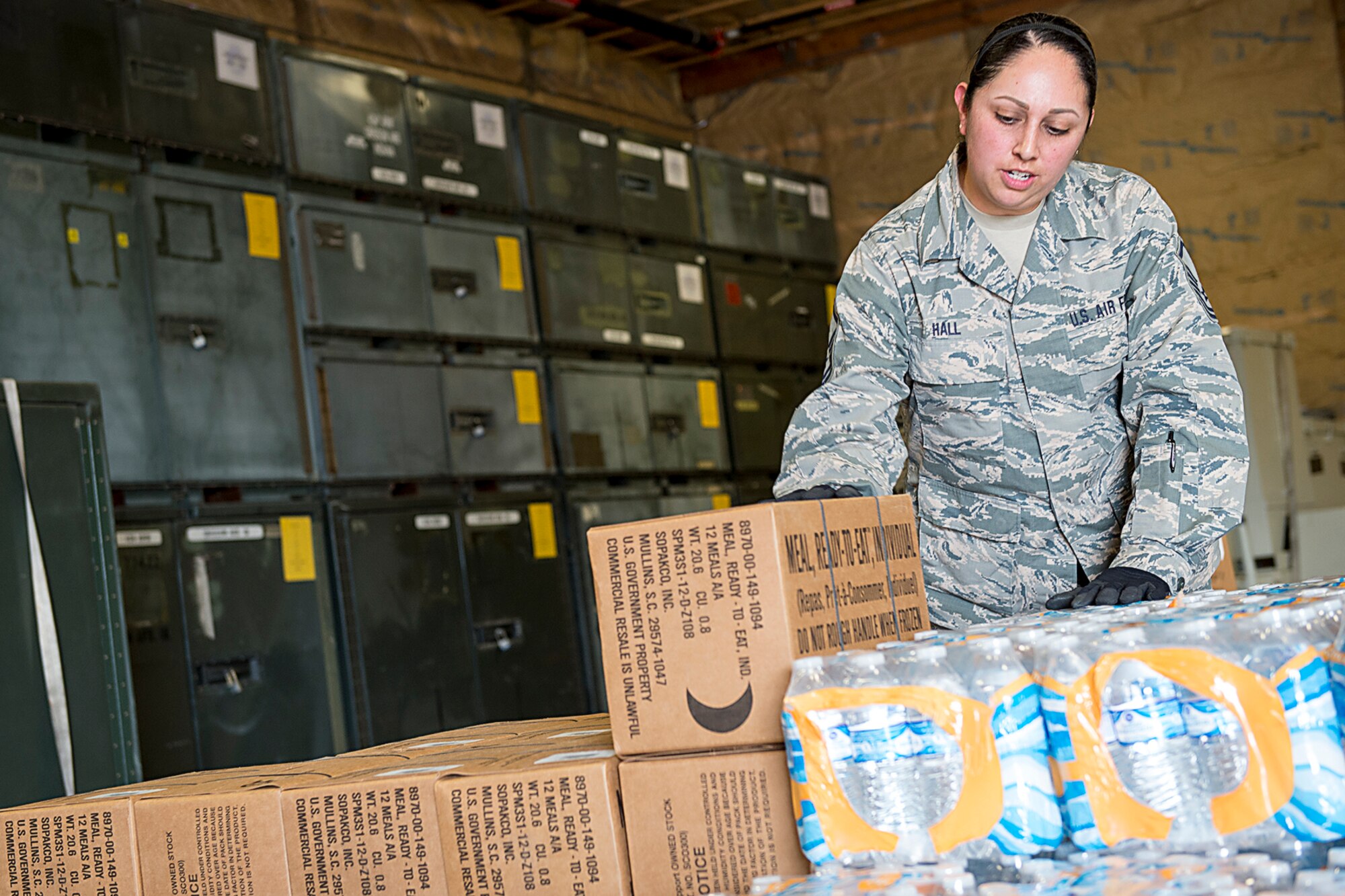 Master Sgt. Angie Hall, 434th Logistics Readiness Squadron combat readiness technician, palletizes water and meals ready to eat at Grissom Air Reserve Base, Ind., Sept. 11, 2017. The cargo is being prepared for shipment to Florida as part of Hurricane Irma relief efforts. (U.S. Air Force photo/Douglas Hays)