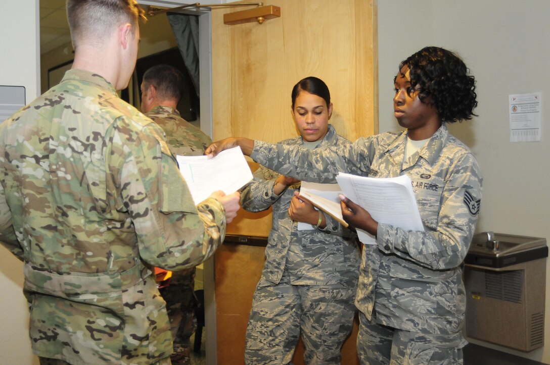 Airman 1st Class Narissa Bennett and Staff Sgt. Amy Akpiri, both members of the 137th Special Operations Force Support Squadron at Will Rogers Air National Guard Base in Oklahoma City, in-process personal back from a recent deployment during their annual training days at the 1st Special Operations Wing, Hurlburt Field, Florida, Aug. 10, 2017. Twenty Airmen from the 137th FSS attended the training event to integrate with active duty personnel on lodging, mortuary, fitness, contingency operations, training and readiness and other duties that are part of their squadron readiness requirements. (U.S. Air National Guard photo by Tech. Sgt. Trisha K. Shields/Released)