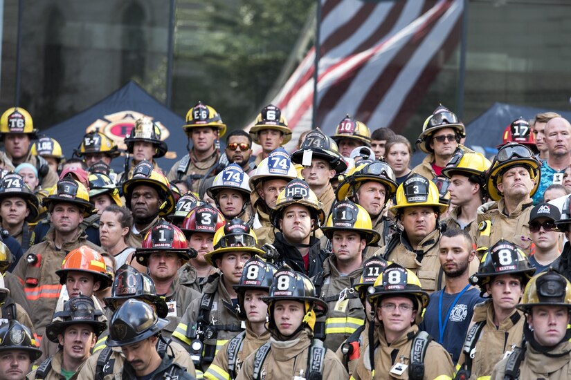 Participants of the 2017 Richmond 9/11 Memorial Stair Climb stand together during opening the ceremony