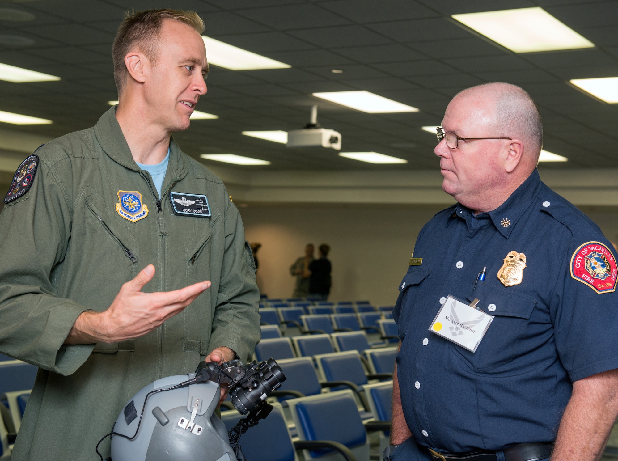 U.S. Air Force Col. Cory Cook, 349th Operations Group, talks with Honorary Commander Alan Hartford during his tour of the 60th Operations Group at Travis Air Force Base, Calif., Sep. 1, 2017.  The purpose of the Travis Air Force Base Honorary Commander Program is to promote relationships between base senior leadership and civilian partners, foster civic appreciation of the Air Force mission and its Airmen, maximize opportunities to share the Air Force story with new stewards, and to communicate mutual interest, challenges, and concerns that senior leaders and civilian stakeholders have in common. (U.S. Air Force photo by Louis Briscese)