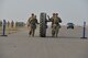 A team of security forces Airmen roll a tire down the flight line during the annual Aces Cop Combat Challenge Sept. 8, 2017, at Malmstrom Air Force Base, Mont. Thirteen teams of defenders from the 341st Security Forces Group participated in the annual competition. (U.S. Air Force photo/Airman 1st Class Daniel Brosam)
