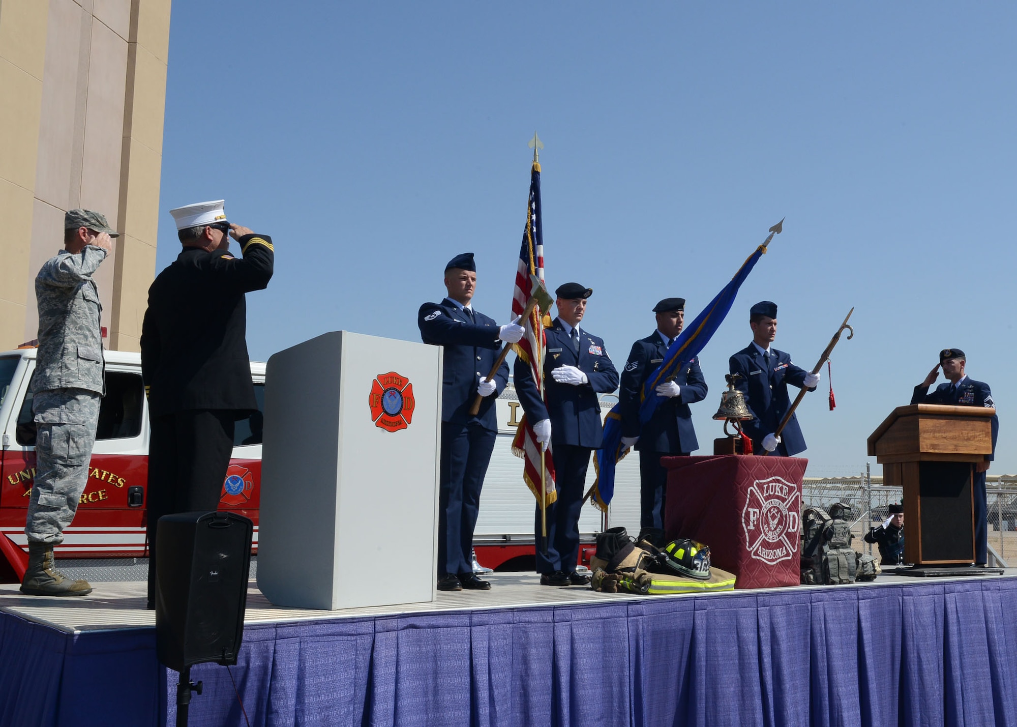 Airmen from the 56th Civil Engineer Squadron perform a color guard sequence during Team Luke’s 9/11 remembrance ceremony Sept. 11, 2017 at Luke Air Force Base, Ariz. The ceremony included a flag unfurling, recount of events, a moment of silence and a ten story stair climb honoring those who lost their lives during the terrorist attack. (U.S. Air Force photo/ Senior Airman James Hensley)