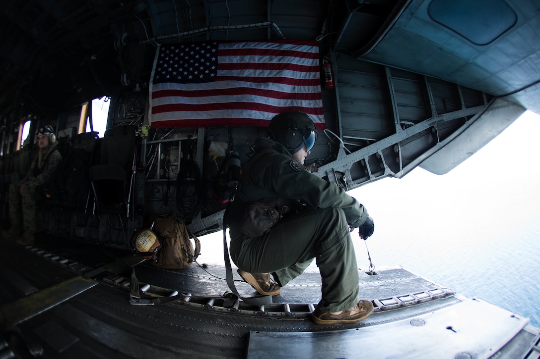 U.S. Marine Corps Sgt. Andrew J. Mocarski with Marine Medium Tiltrotor Squadron (VMM) 162 (Reinforced), 26th Marine Expeditionary Unit (MEU), looks out the back of a CH-53E Super Stallion to deliver essential emergency care items to St. Thomas, U.S. Virgin Islands, Sept. 10, 2017. The 26th MEU is supporting authorities in the U.S. Virgin Islands with the combined goal of protecting the lives and safety of those in affected areas.