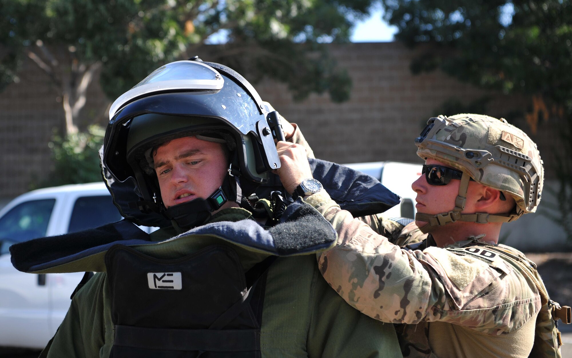 9th Civil Engineer Squadron explosive ordnance technicians, Senior Airman Jared Basham (right) and Staff Sgt. Robert Powell prepare to respond to a scenario during Urban Shield