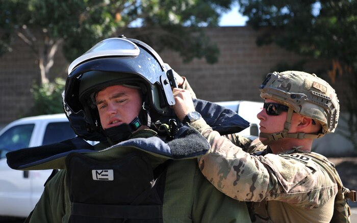 9th Civil Engineer Squadron explosive ordnance technicians, Senior Airman Jared Basham (right) and Staff Sgt. Robert Powell prepare to respond to a scenario during Urban Shield