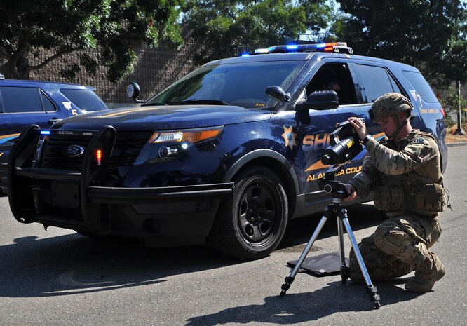 Senior Airman Jared Basham, 9th Civil Engineer Squadron explosive ordnance technician, sets up an x-ray machine in order to view the inside of a simulated explosive device during Urban Shield