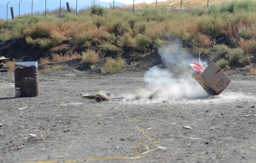 9th Civil Engineer Squadron explosive ordnance technicians disable a simulated explosive device