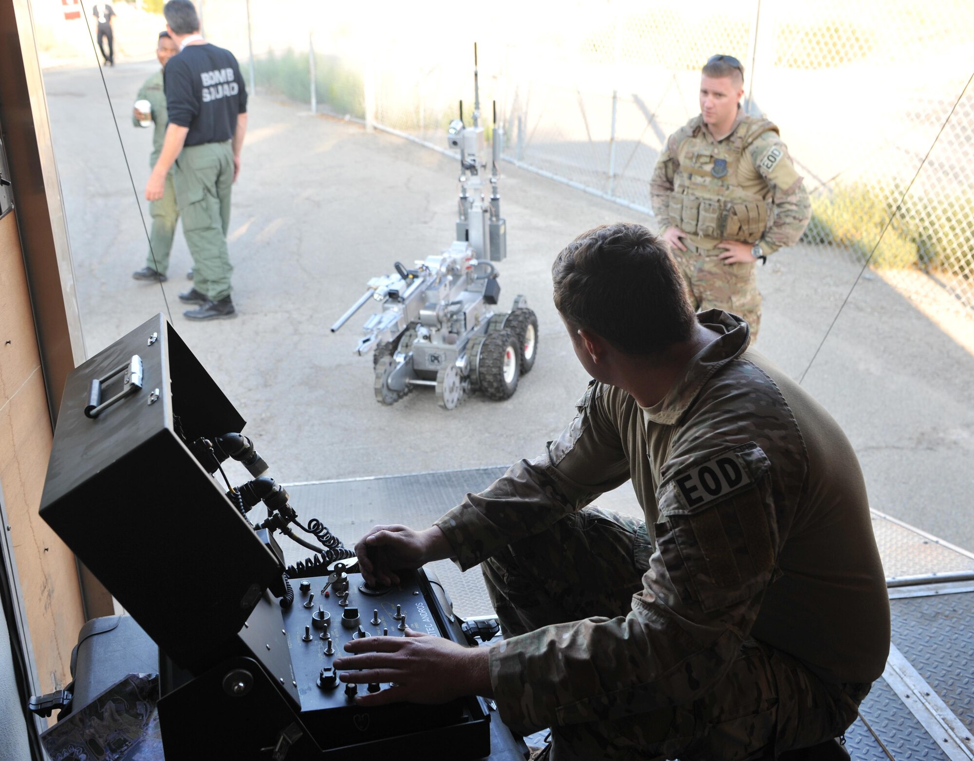 Staff Sgt. Robert Powell (front), 9th Civil Engineer Squadron explosive ordnance technician, operates a robot during Urban Shield