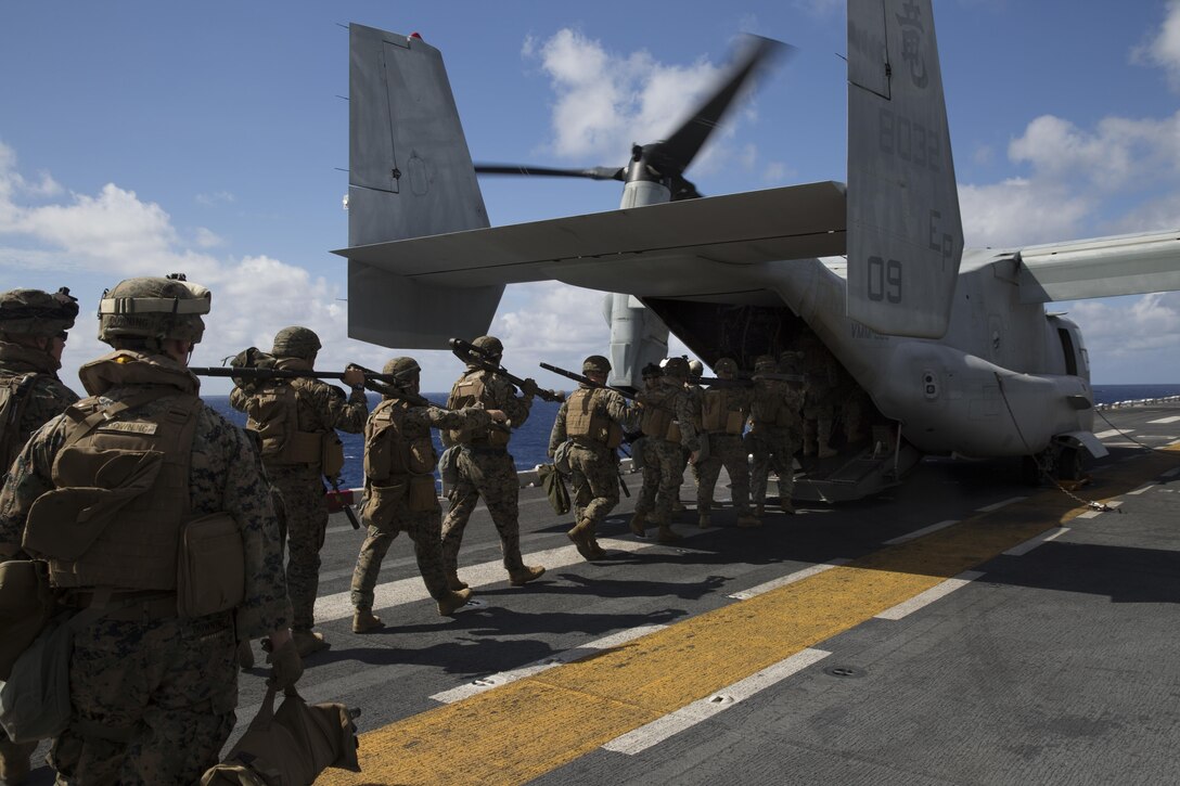 Marines with Kilo Company, Battalion Landing Team, 3rd Battalion, 5th Marines, board an MV-22B Osprey tiltrotor aircraft during Exercise Talisman Saber 2017 aboard the USS Bonhomme Richard (LHD-6) while at sea in the Pacific Ocean, July 8, 2017.