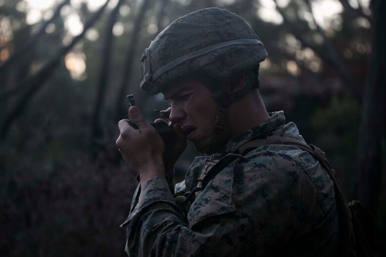 Cpl. Jesse A. Beaver, a team leader with India Company, Battalion Landing Team, 3rd Battalion, 5th Marines, shoots an azimuth with a lensatic compass during an amphibious raid as part of the 31st Marine Expeditionary Unit’s Certification Exercise at Freshwater Beach, Shoalwater Bay Training Area, Queensland, Australia, August 16, 2018.