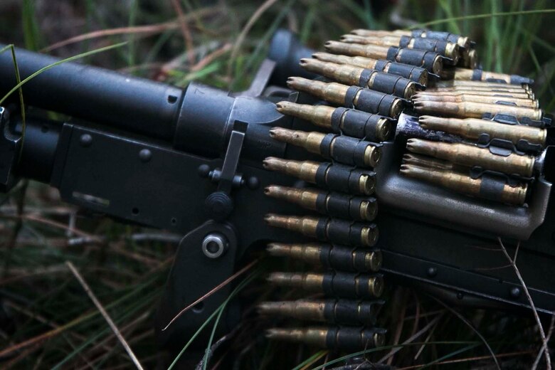 An M240G medium machine gun sits ready while Marines with India Company, Battalion Landing Team, 3rd Battalion, 5th Marines, hold security during an amphibious raid as part of the 31st Marine Expeditionary Unit’s Certification Exercise at Freshwater Beach, Shoalwater Bay Training Area, Queensland, Australia, August 16, 2018.