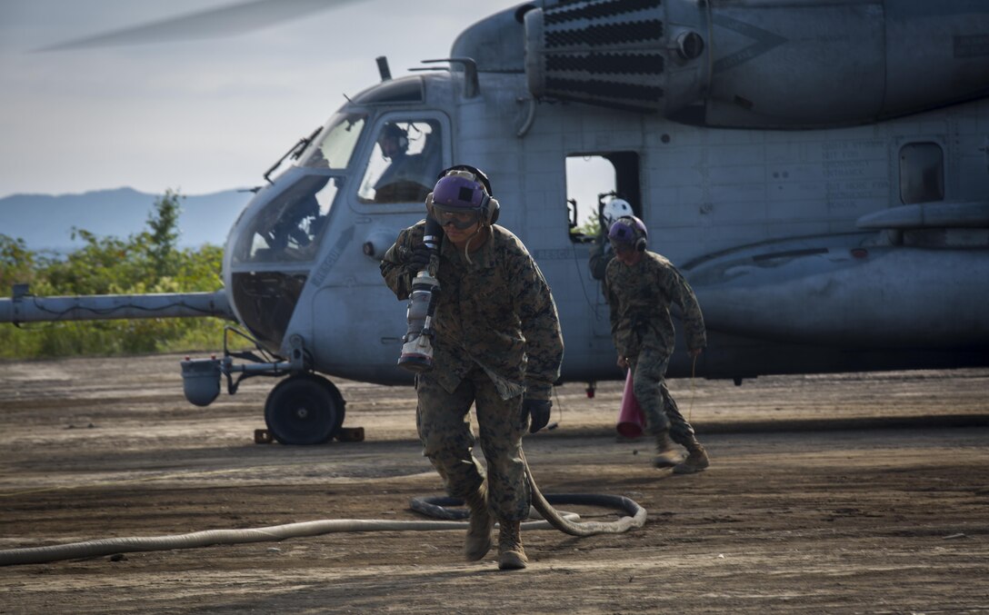 U.S. Marines refuel a CH-53E Super Stallion at a forward arming refueling point in Hokkaido, Japan, August 16, 2017, in support of Northern Viper 2017. The FARP mission is to provide fuel and ordnance necessary for aircraft to minimize response time and decrease turnaround time during operations. NV17 tests the interoperability and bilateral capability of the Japan Ground Self-Defense Force and U.S. Marine Corps forces to work together and provides the opportunity to conduct realistic training in an unfamiliar environment. The Marines are assigned to Marine Wing Support Squadron 172, Marine Aircraft Group 36, 1st Marine Aircraft Wing. (U.S. Marine Corps photo by Lance Cpl. Andy Martinez)