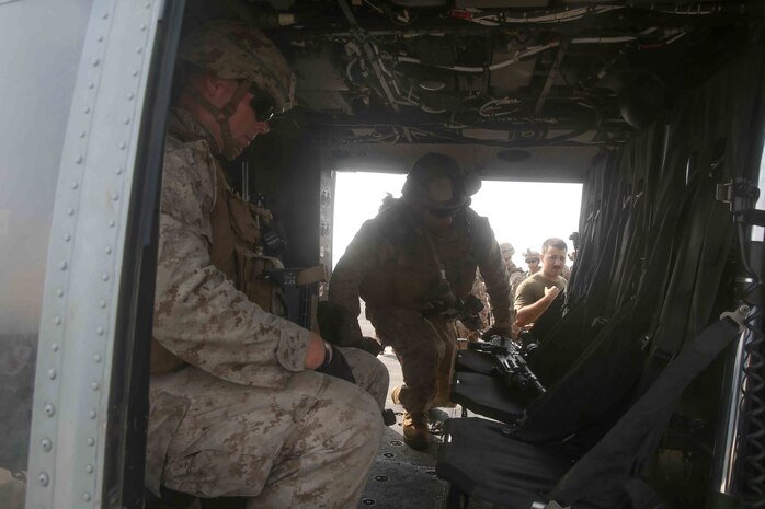 Marines with the 15th Marine Expeditionary Unit’s Battalion Landing Team 1/5, practice loading into a UH-1Y Huey to conduct a Tactical Recovery of Aircraft and Personnel air familiarization drill aboard USS San Diego (LPD 22) during exercise Alligator Dagger.
