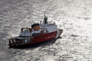 A ship travels through the ocean.