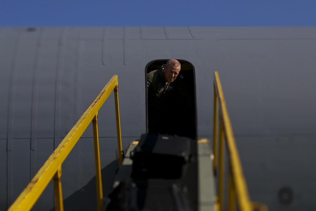U.S. Air Force Chief Master Sgt. Michael Sylvester, 108th Operations Group Superintendent, helps to bring baggage onto a 108th Wing KC-135 Stratotanker at Joint Base McGuire-Dix-Lakehurst, N.J., Aug. 20, 2017. The 108th Wing is deploying aircraft and airmen to Andersen Air Force Base, Guam. (U.S. Air National Guard photo by Master Sgt. Matt Hecht/Released)