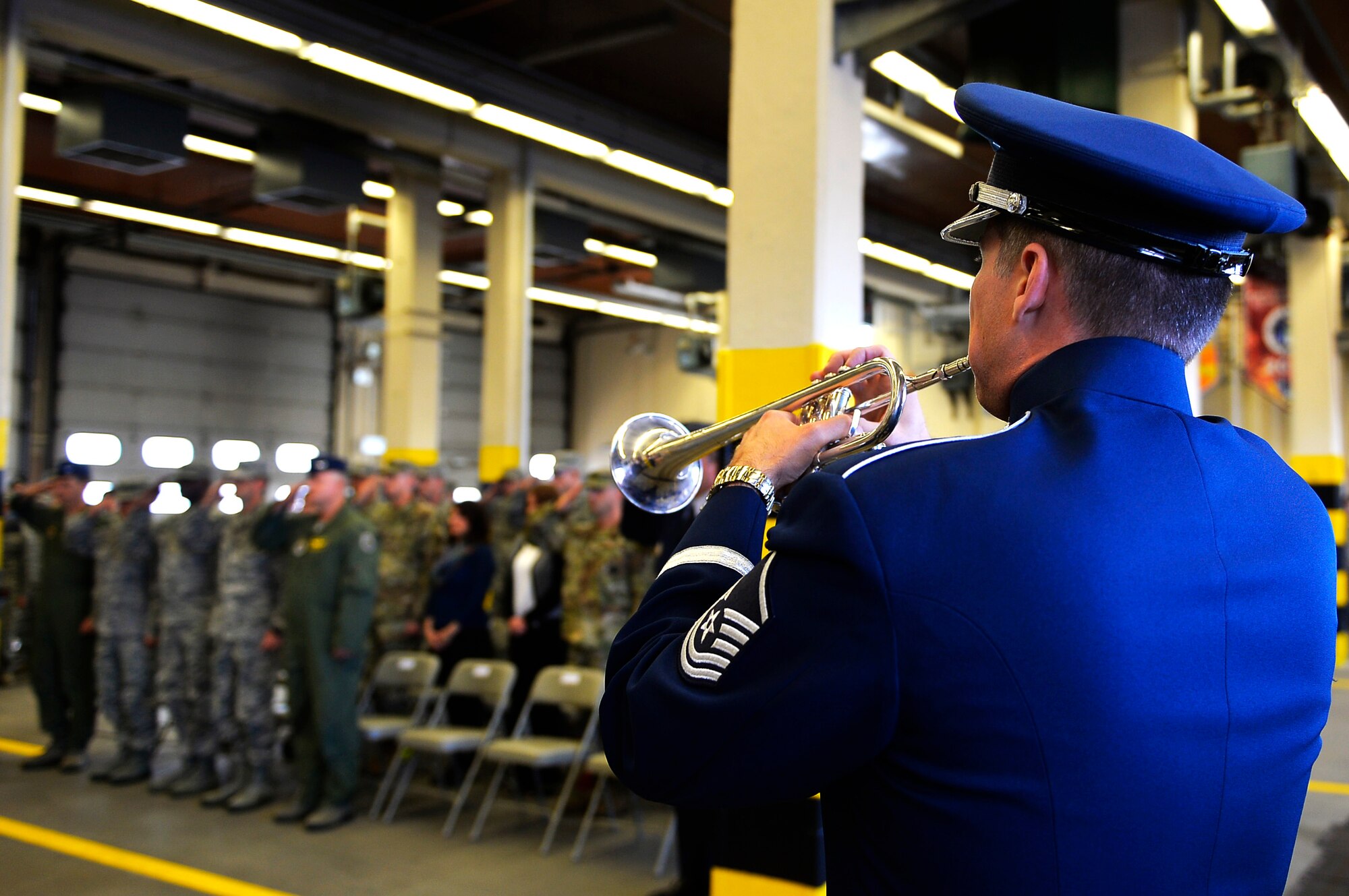 A U.S. Air Forces in Europe band member plays taps during a 9/11 retreat ceremony on Ramstein Air Base, Germany, Sept. 11, 2017. The ceremony commemorated 2,996 people who lost their lives in the attacks on the World Trade Center, the Pentagon, and the crash of United Airlines flight 93, 16 years ago. (U.S. Air Force photo by Airman 1st Class Joshua Magbanua)