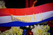 A ribbon on a wreath displays the words “Remember 9/11” during a retreat ceremony on Ramstein Air Base, Germany, Sept. 11, 2017. The ceremony marked 16 years since the attacks on the World Trade Center, the Pentagon, and the hijacking of United Airlines flight 93. (U.S. Air Force photo by Airman 1st Class Joshua Magbanua)