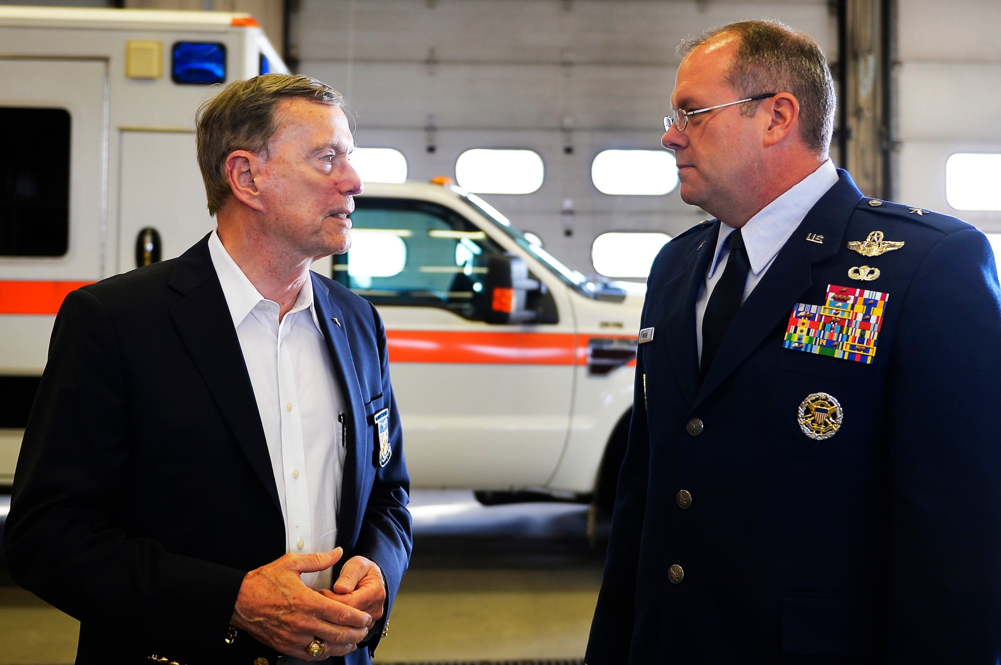 U.S. Air Force Brig. Gen. Richard G. Moore, 86th Airlift Wing commander, right, speaks with retired Col. Kenneth Cordier, left, a former prisoner of war, after a 9/11 retreat ceremony on Ramstein Air Base, Germany, Sept. 11, 2017. The event was attended by distinguished visitors and first responders in the Kaiserslautern Military Community. (U.S. Air Force photo by Airman 1st Class Joshua Magbanua)