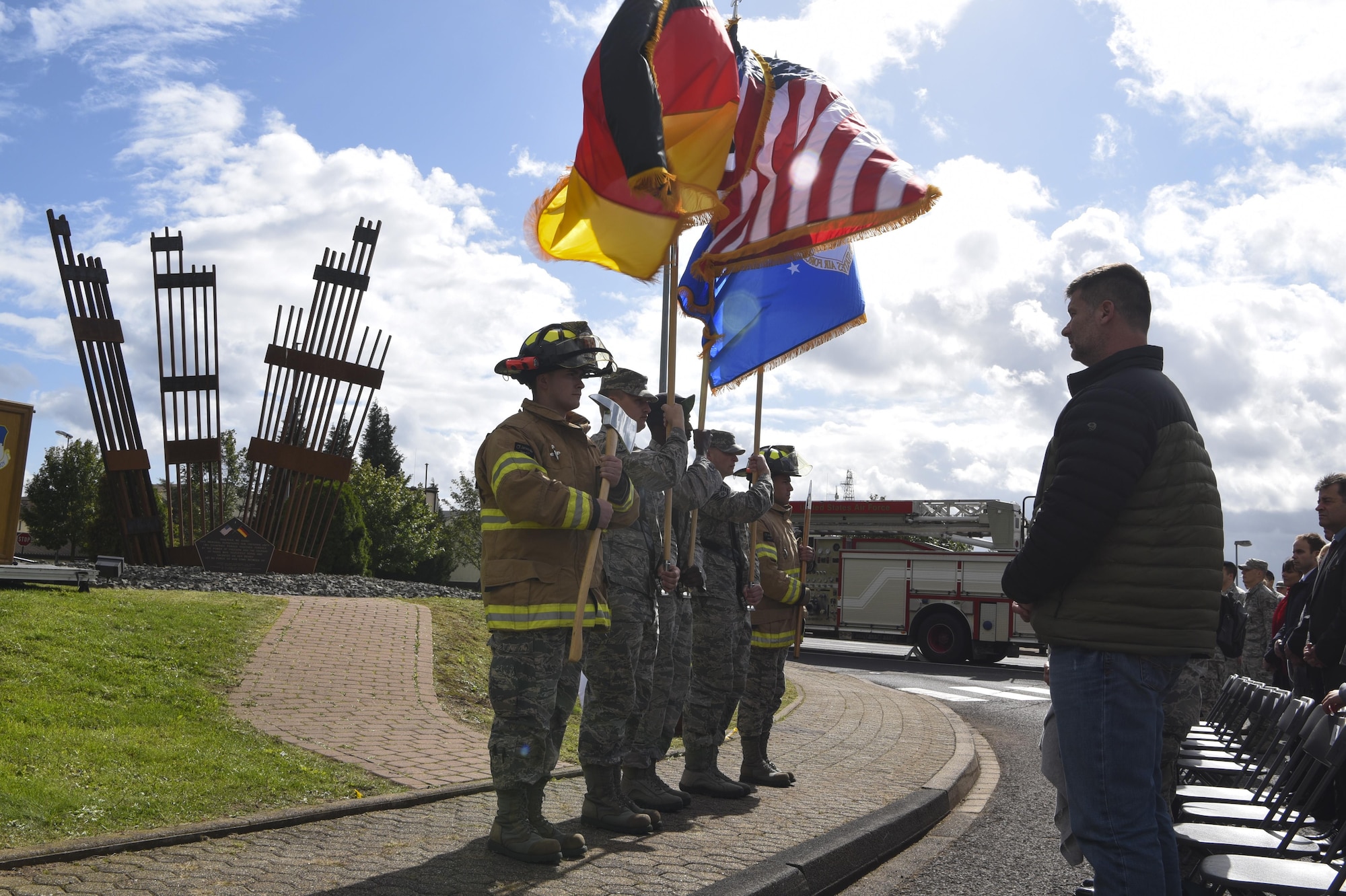 The 52nd Fighter Wing Honor Guard posts the flags of the United States, Germany and the Air Force during the 9/11 memorial ceremony at the air park on Spangdahlem Air Base, Germany, September 11, 2017. Ceremonies throughout the Air Force and around the world took place to commemorate the 16th anniversary of the attacks on 9/11. (U.S. Air Force photo by Senior Airman Dawn M. Weber)