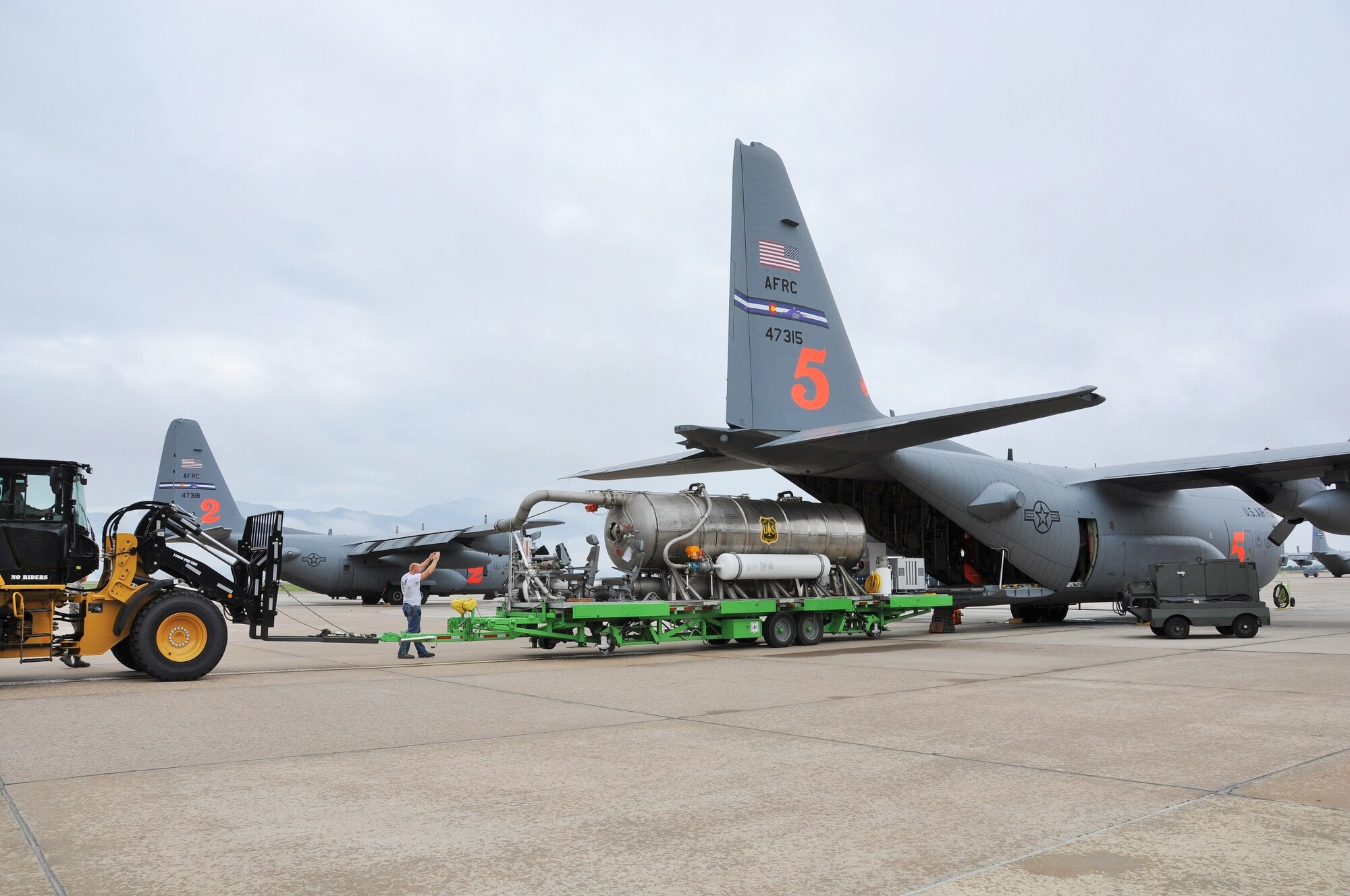 Aerial porters assigned to the Air Force Reserve Command’s 302nd Airlift Wing load a U. S. Forest Service Modular Airborne Fire Fighting System onto a C-130 Hercules here, July 29, 2017