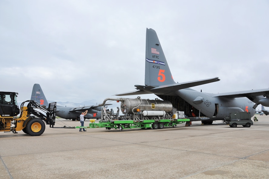 Aerial porters assigned to the Air Force Reserve Command’s 302nd Airlift Wing load a U. S. Forest Service Modular Airborne Fire Fighting System onto a C-130 Hercules here, July 29, 2017
