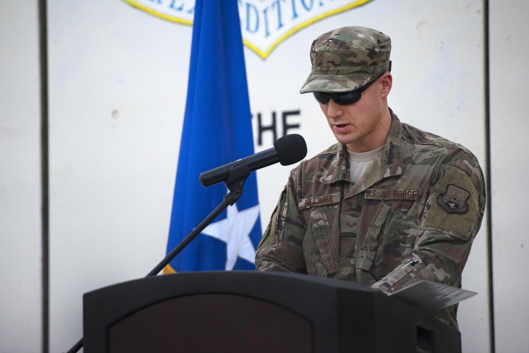 An airman speaks at a 9/11 remembrance ceremony.