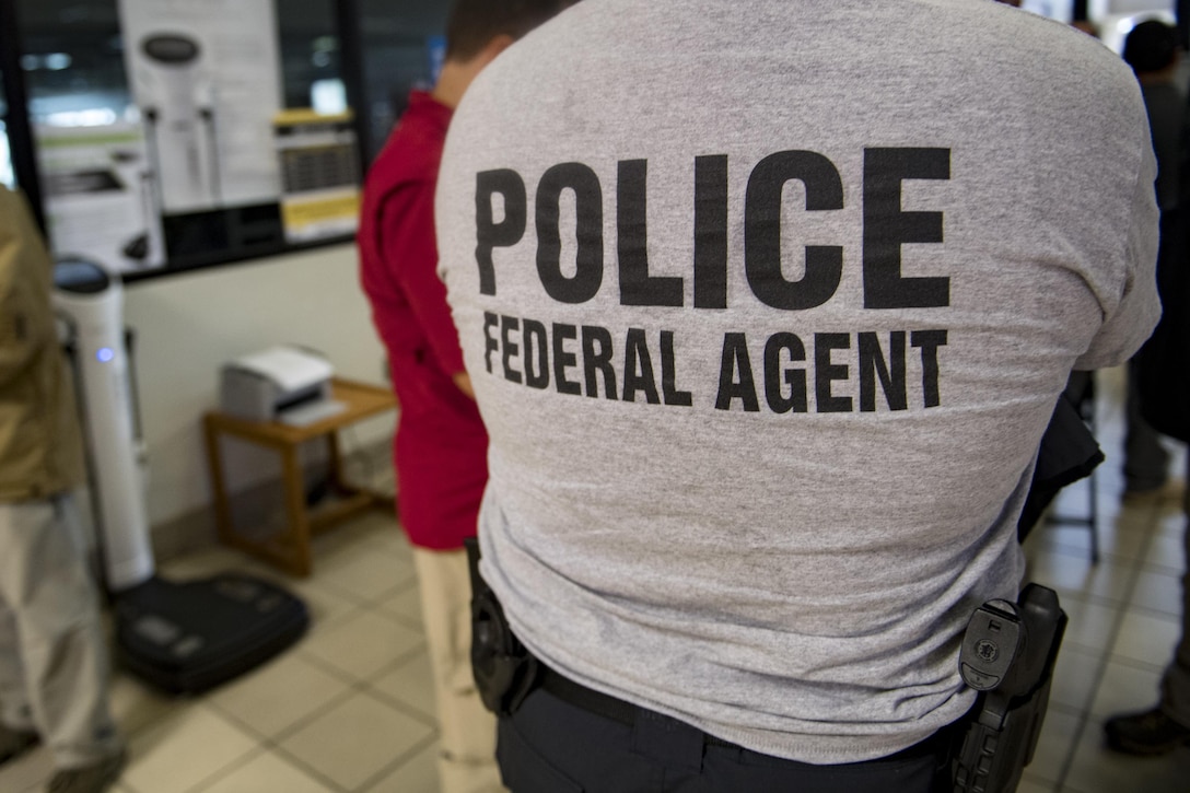 Members from various federal law enforcement agencies wait in line to in-process, Sept. 10, 2017, at Moody Air Force Base, Ga. Moody Air Force Base hosted approximately 400 members from 14 different federal agencies who will deploy to conduct security or search and rescue missions in areas effected by Hurricane Irma. (U.S. Air Force photo by Airman 1st Class Daniel Snider)