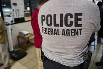 Members from various federal law enforcement agencies wait in line to in-process, Sept. 10, 2017, at Moody Air Force Base, Ga. Moody Air Force Base hosted approximately 400 members from 14 different federal agencies who will deploy to conduct security or search and rescue missions in areas effected by Hurricane Irma. (U.S. Air Force photo by Airman 1st Class Daniel Snider)