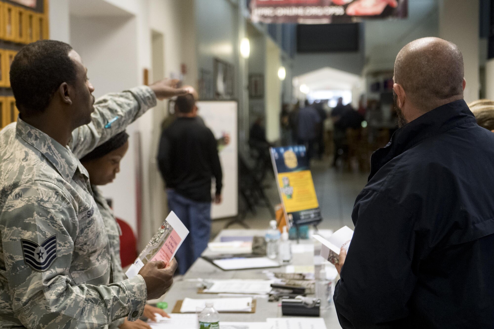 U.S. Air Force Tech. Sgt. Gerrod Suber, 23d Force Support Squadron personnel specialist, directs members from various federal law enforcement agencies through in-processing procedures, Sept. 10, 2017, at Moody Air Force Base, Ga. Moody Air Force Base hosted approximately 400 members from 14 different federal agencies who will deploy to conduct security or search and rescue missions in areas effected by Hurricane Irma. (U.S. Air Force photo by Airman 1st Class Daniel Snider)