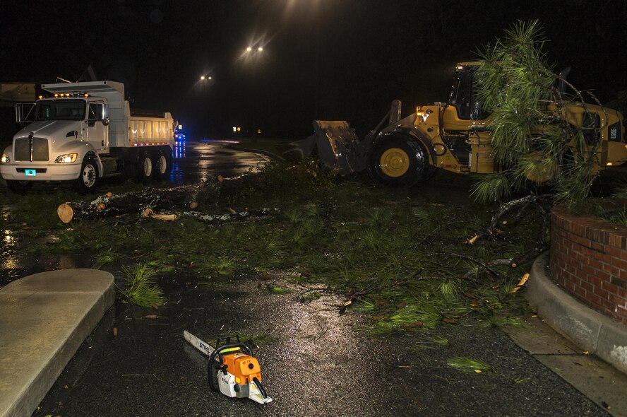 23rd Civil Engineer Squadron heavy equipment operators clear a fallen tree from in front of the Davidson Road Gate, Sept. 11, 2017, at Moody Air Force Base, Ga. Moody’s ride-out team consisted of approximately 80 Airmen who were tasked with immediately responding to mission-inhibiting damage caused by Hurricane Irma. (U.S. Air Force photo by Airman 1st Class Daniel Snider)