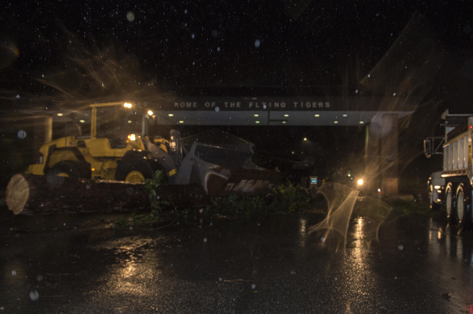 23rd Civil Engineer Squadron heavy equipment operators clear a fallen tree from in front of the Davidson Road Gate, Sept. 11, 2017, at Moody Air Force Base, Ga. Moody’s ride-out team consisted of approximately 80 Airmen, who were tasked with immediately responding to mission-inhibiting damage caused by Hurricane Irma. (U.S. Air Force photo by Airman 1st Class Daniel Snider)