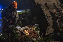 Senior Airman Justin Benito, 23rd Civil Engineer Squadron heavy equipment operator, uses a chainsaw to cut a fallen tree’s trunk, Sept. 11, 2017, at Moody Air Force Base, Ga. Moody’s ride-out team consisted of approximately 80 Airmen who were tasked with immediately responding to mission-inhibiting damage caused by Hurricane Irma. (U.S. Air Force photo by Airman 1st Class Daniel Snider)