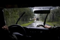 Members of Moody’s ride-out team slow their vehicle behind 23rd Civil Engineer Squadron heavy equipment operators, Sept. 11, 2017, at Moody Air Force Base, Ga. Moody’s ride-out team consisted of approximately 80 Airmen who were tasked with immediately responding to mission-inhibiting damage caused by Hurricane Irma. (U.S. Air Force photo by Airman 1st Class Daniel Snider)