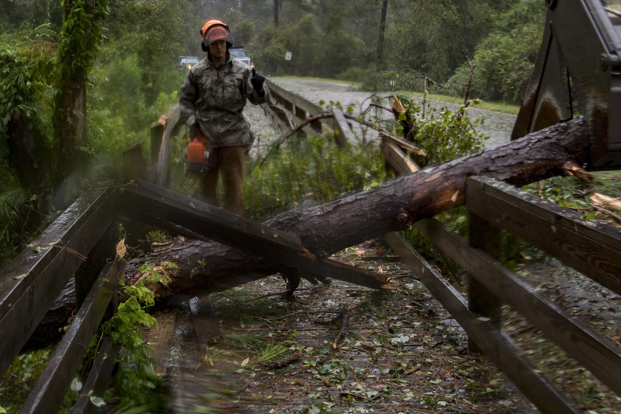 Senior Airman Justin Benito, 23rd Civil Engineer Squadron heavy equipment operator, uses a chainsaw to cut a fallen tree’s trunk, Sept. 11, 2017, at Moody Air Force Base, Ga. Moody’s ride-out team consisted of approximately 80 Airmen who were tasked with immediately responding to mission-inhibiting damage caused by Hurricane Irma. (U.S. Air Force photo by Airman 1st Class Daniel Snider)