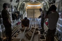 Members of the 71st Rescue Squadron secure sea marker dye in the back of the HC-130J Combat King II, Sept. 11, 2017 at Jackson-Medgar Wiley Evers Air National Guard Base, Miss. Aircraft and personnel from the 563d Rescue Group mobilized to Homestead ARB to assist in rescue efforts after Hurricane Irma made landfall. The 563d RQG is supporting FEMA’s disaster response efforts. (U.S. Air Force photo by Tech. Sgt. Zachary Wolf)