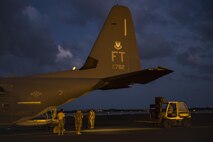 Airmen from the 23d Wing unload an HC-130J Combat King II, Sept. 11, 2017, at Homestead Air Reserve Base, Fla. Aircraft and personnel from the 563d Rescue Group mobilized to Homestead ARB to assist in rescue efforts after Hurricane Irma made landfall. The 563d RQG is supporting FEMA’s disaster response efforts. (U.S. Air Force photo by Tech. Sgt. Zachary Wolf)