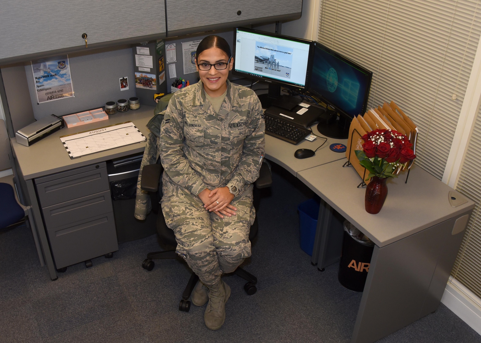 Airman 1st Class Natalie Nieves-Gonzalez poses for a photo at her desk in the retention office Aug. 31, 2017 at Warfield Air National Guard Base, Middle River, Md. Nieves-Gonzalez has worked as the recruiting and retention administrator for about a year. (U.S Air National Guard photo by Senior Airman Enjoli Saunders)
