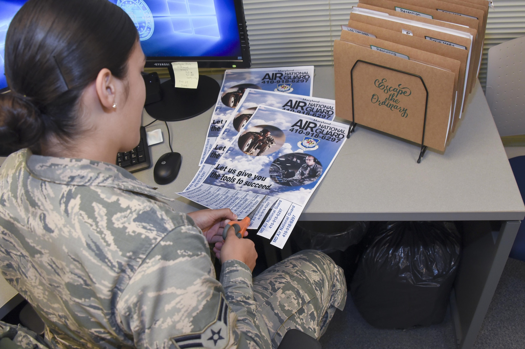 Airman 1st Class Natalie Nieves-Gonzalez prepares information to be distributed for recruiting event Aug. 31, 2017 at Warfield Air National Guard Base, Middle River, Md. Nieves-Gonzalez has worked as the recruiting and retention administrator for about a year. (U.S Air National Guard photo by Senior Airman Enjoli Saunders)